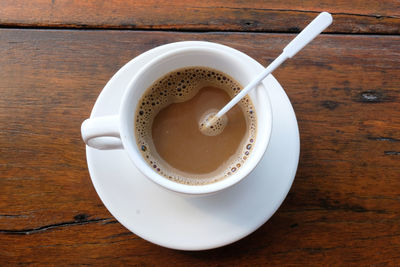 High angle view of coffee cup on table