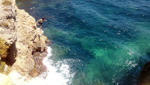 High angle view of rocks in sea