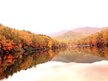 Scenic view of lake with trees in background