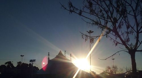 Low angle view of silhouette trees against sky during sunset