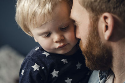 Father spending time with his son at home