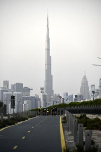 Buildings in city against clear sky