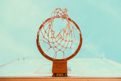 Low angle view of basketball hoop against clear sky