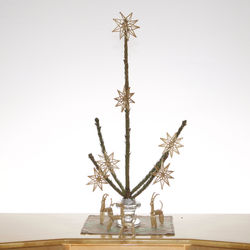 Christmas tree on table against white background