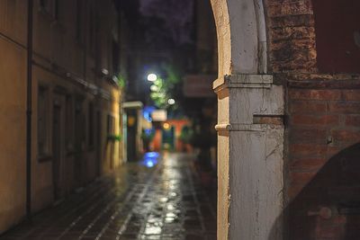 Road along buildings at night