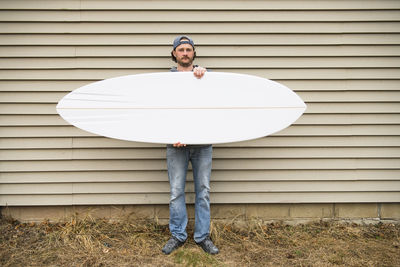 Surfboard shaper refining a new design