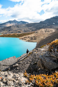 Hiker enjoying sunrise at michelle lakes in the alpine