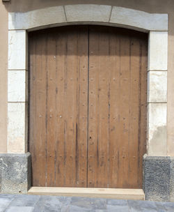 The old big ancient wooden door in spain.