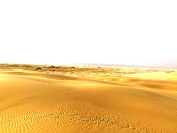 Scenic view of desert against clear sky