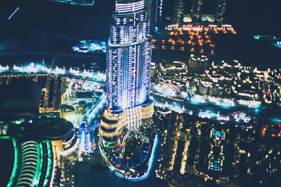 High angle view of illuminated buildings in city at night