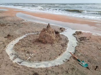 High angle view of driftwood on beach