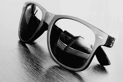 Close-up of sunglasses on table