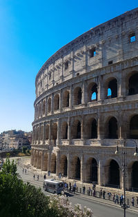 Low angle view of historical building against clear blue sky