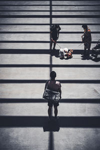 Rear view of man walking on street