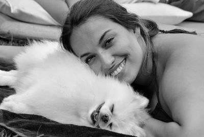 Portrait of smiling young woman with dog