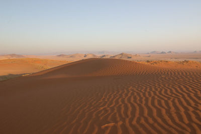 Scenic view of desert against clear sky