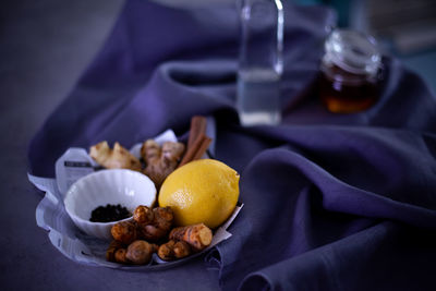 High angle view of fruits in plate on table