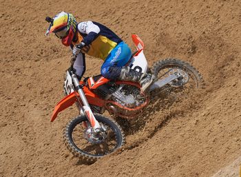 Man riding motorcycle on mud