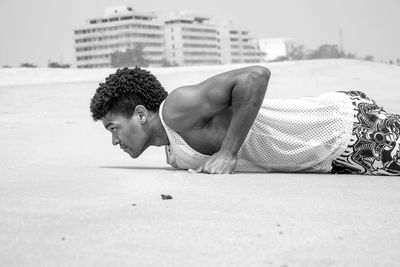 High angle view of man playing on sand at beach