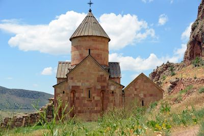 Church amidst buildings against sky