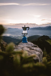 Scenic view of mountains against sky at sunset