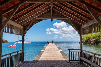 Pier over sea against sky