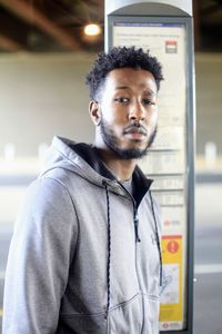 Portrait of young man standing outdoors