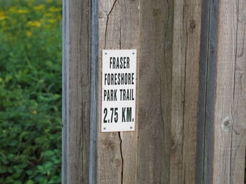 Information sign on wooden post