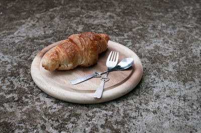 High angle view of croissant in plate on table