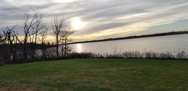 Scenic view of field against sky during sunset