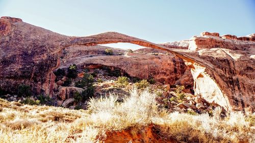 View of landscape with mountain range in background