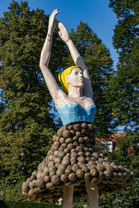 Low angle view of statue against trees