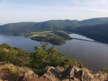 Scenic view of lake and mountains against sky