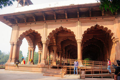 Group of people in front of historical building