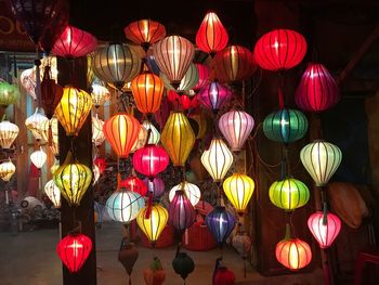 Illuminated lanterns hanging at night for sale