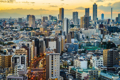 High angle view of modern buildings in city against sky