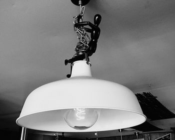 Low angle view of electric lamp hanging