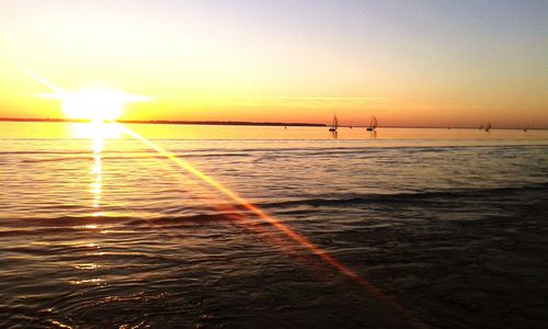 Scenic view of sea at sunset