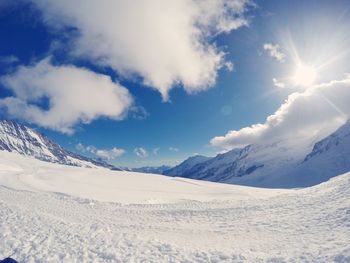 Scenic view of snow mountains against sky