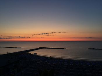 Scenic view of sea against sky at sunset