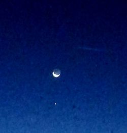 View of moon in blue sky