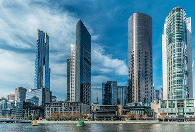 Skyscrapers in city against sky