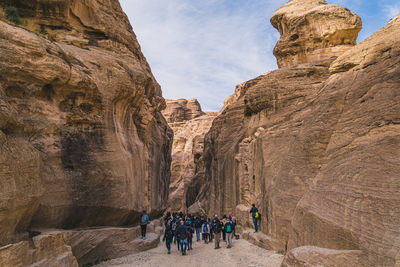 Group of people walking on rocks