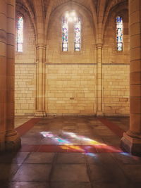 Illuminated building seen through window