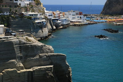 High angle view of buildings by sea