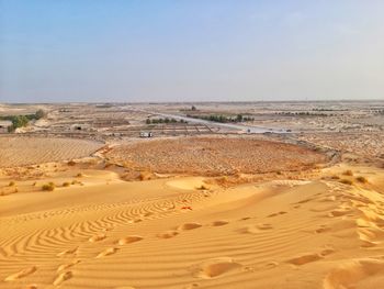 Scenic view of beach against clear sky