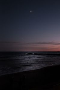 Scenic view of sea against sky at night