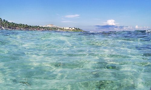 Scenic view of sea against blue sky