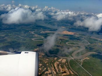 Aerial view of landscape against sky seen from airplane