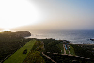 High angle view of beach against sky during sunset